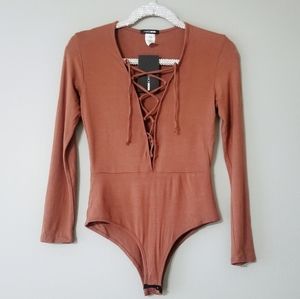 Fashion Nova burnt orange lace up bodysuit M